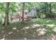 Beautiful backyard featuring a deck, hot tub, and plenty of space for outdoor activities and enjoyment at 173 Rocky River Rd, Mooresville, NC 28115