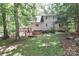 Relaxing backyard featuring a back deck, hot tub, and plenty of shady mature trees at 173 Rocky River Rd, Mooresville, NC 28115