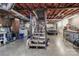 Basement has laundry, stairs, car, work bench, and exposed duct work and insulation at 173 Rocky River Rd, Mooresville, NC 28115