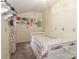 Cozy bedroom with bright walls, carpet, and a twin size bed with built-in storage at 173 Rocky River Rd, Mooresville, NC 28115