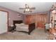 Comfortable bedroom features carpet, ceiling fan, and wooden closets for storage space at 173 Rocky River Rd, Mooresville, NC 28115