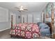 This comfortable bedroom features carpet, ceiling fan, and multiple closets for storage space at 173 Rocky River Rd, Mooresville, NC 28115