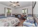 Bedroom features hardwood floors, neutral paint and an overhead ceiling fan at 173 Rocky River Rd, Mooresville, NC 28115