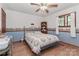 Bedroom features hardwood floors, neutral paint and an overhead ceiling fan at 173 Rocky River Rd, Mooresville, NC 28115