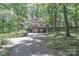 Charming home nestled among mature trees, featuring a spacious deck and attached garage at 173 Rocky River Rd, Mooresville, NC 28115
