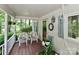 Inviting porch, perfect for relaxing, with comfortable seating and charming decor at 173 Rocky River Rd, Mooresville, NC 28115