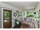 Relaxing front porch with a porch swing, vintage decor, and a welcoming atmosphere for guests at 173 Rocky River Rd, Mooresville, NC 28115