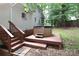 Backyard features a relaxing hot tub on a wood deck with access steps for outdoor enjoyment at 173 Rocky River Rd, Mooresville, NC 28115