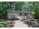 Exterior view of a white outbuilding with ample parking at 173 Rocky River Rd, Mooresville, NC 28115