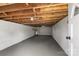 Spacious basement featuring exposed wood beams, painted white walls, and a concrete floor at 1746 2Nd Street Sw Pl, Hickory, NC 28602