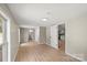 Bright bedroom with wood-look flooring and ensuite bathroom and kitchen access at 1746 2Nd Street Sw Pl, Hickory, NC 28602