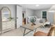 Inviting bedroom with light wood floors featuring desk and dresser; open to living room at 1746 2Nd Street Sw Pl, Hickory, NC 28602