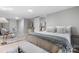 Neutral-toned bedroom with a bed, desk, and ensuite bathroom at 1746 2Nd Street Sw Pl, Hickory, NC 28602