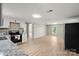Bright, open kitchen featuring white cabinets, stainless steel appliances, and wood-look flooring at 1746 2Nd Street Sw Pl, Hickory, NC 28602