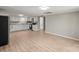 Open-concept kitchen and living area with new floors and stainless-steel appliances at 1746 2Nd Street Sw Pl, Hickory, NC 28602