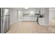 A well-lit kitchen with white cabinets, granite countertops, and stainless steel appliances at 1746 2Nd Street Sw Pl, Hickory, NC 28602