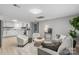 Open-concept living area with kitchen, featuring modern furniture, decor, and ample light at 1746 2Nd Street Sw Pl, Hickory, NC 28602