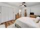 Comfortable bedroom with white linens, a ceiling fan, a closet, and an ensuite bathroom at 1817 Rush Wind Dr, Charlotte, NC 28206