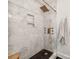 Luxurious marble shower with bronze fixtures, built-in shelving, and bench seat at 1817 Rush Wind Dr, Charlotte, NC 28206