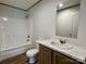 Bathroom featuring a tub and shower, toilet, sink, and marble countertop at 188 Trivette Rd, Harmony, NC 28634