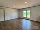 Bedroom features hardwood floors, a window, recessed lighting, and neutral-colored walls at 188 Trivette Rd, Harmony, NC 28634