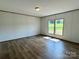 Cozy bedroom with natural light, wood-look floors, and neutral walls at 188 Trivette Rd, Harmony, NC 28634