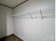 A walk-in closet features a white wire shelf for clothing and accessory storage at 188 Trivette Rd, Harmony, NC 28634