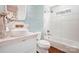 Modern bathroom features a pedestal sink, white subway tiles, and a glass shower at 19946 River Falls Dr, Davidson, NC 28036