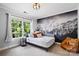 Serene bedroom with mountain mural and large window offering picturesque views at 19946 River Falls Dr, Davidson, NC 28036