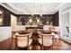 Dining room with elegant wallpaper, chandelier, large dining table, and seating for six at 19946 River Falls Dr, Davidson, NC 28036