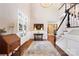 Grand foyer featuring dark wood floors, a staircase, high ceilings, and decorative accents at 19946 River Falls Dr, Davidson, NC 28036