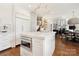 Bright, open kitchen with center island, modern appliances, and seamless access to dining area at 19946 River Falls Dr, Davidson, NC 28036