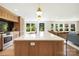 Bright, open kitchen featuring a large island, modern appliances, and stylish finishes at 19946 River Falls Dr, Davidson, NC 28036