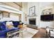 Cozy living room featuring a stone fireplace, built-in shelves, and comfortable blue sofas at 19946 River Falls Dr, Davidson, NC 28036