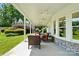 Inviting outdoor patio area with comfortable seating and a beautifully landscaped yard at 19946 River Falls Dr, Davidson, NC 28036