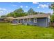 Exterior view of the backyard featuring a grassy lawn at 211 Ridgecrest St, Kannapolis, NC 28081