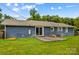 Backyard view showcasing lush greenery and the home's exterior at 211 Ridgecrest St, Kannapolis, NC 28081