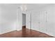 This bedroom features wood floors, overhead lighting, and closet at 211 Ridgecrest St, Kannapolis, NC 28081