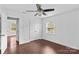Charming bedroom with hardwood floors, ample closet space, and natural light streaming through two windows at 211 Ridgecrest St, Kannapolis, NC 28081