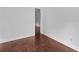Clean, simple room featuring hardwood flooring and white walls ready for a fresh design at 211 Ridgecrest St, Kannapolis, NC 28081