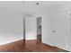 Bedroom with hardwood floors and neutral walls with white trim, ready for move-in at 211 Ridgecrest St, Kannapolis, NC 28081