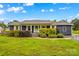 Charming single story home with well-maintained landscaping, blue siding, and white trim at 211 Ridgecrest St, Kannapolis, NC 28081