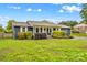 Charming single story home with well-maintained landscaping, blue siding, and white trim at 211 Ridgecrest St, Kannapolis, NC 28081