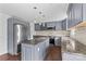 Updated kitchen with gray cabinets, stainless steel appliances, and granite countertops at 211 Ridgecrest St, Kannapolis, NC 28081