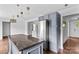 Kitchen island features granite countertops and stainless steel refrigerator at 211 Ridgecrest St, Kannapolis, NC 28081