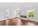 Bright living room with fireplace, large windows, and hardwood floors at 211 Ridgecrest St, Kannapolis, NC 28081