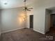Large bedroom with neutral paint and ample closet space with a ceiling fan at 2958 Iron Gate Ln, Charlotte, NC 28212