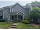 Charming gray townhouse with well-manicured lawn and a welcoming walkway at 2958 Iron Gate Ln, Charlotte, NC 28212