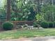 Brick sign with 'Firethorne' in gold letters surrounded by landscaping and trees at 2958 Iron Gate Ln, Charlotte, NC 28212
