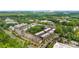 Aerial view of a neighborhood in Charlotte, NC with lush trees and the city skyline at 3748 Ellington St, Charlotte, NC 28211